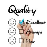 we strive for excellence 22178970 - hand putting check mark with blue marker on excellent quality evaluation form